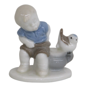 West Germany Porcelain Boy and Bird Small Figurine With Glossy Finish 4499b