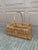 A beautifully woven early 20th century American splint oak basket with warm honeyed tones and a tightly constructed...