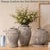 Add timeless rustic charm and artisanal character to your home with this beautifully textured brown ceramic flower vase....