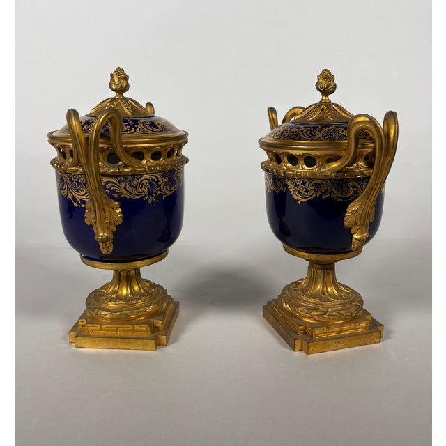 Pair of Louis XVI period Sèvres porcelain potpourri jars Pair of porcelain and gilt bronze potpourri jars French work,...