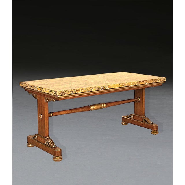 A fabulous regency marble top centre table, the thick veneer top of wonderfully figured book matched italian giallo siena...