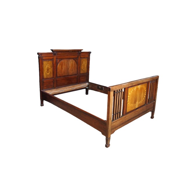This antique Edwardian bed frame is crafted from rich, warm mahogany and heavily characterized by its elegant fruitwood...
