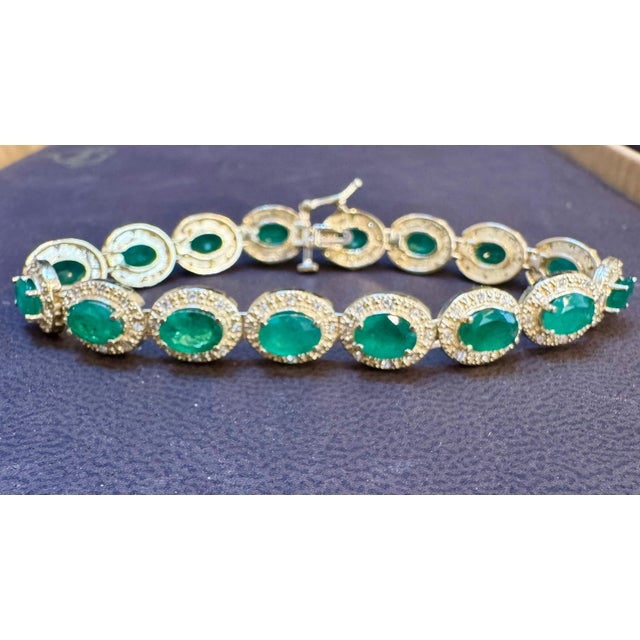 Approximately 16 Carat Oval cut Emeralds & Diamond Tennis Bracelet 14 Karat Yellow Gold 7 Inches This exceptionally...