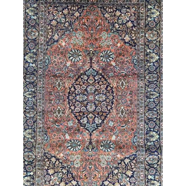 Pretty vintage silk Kashmir rug with beautiful floral design and nice colours with orange field, navy blue, green, yellow,...
