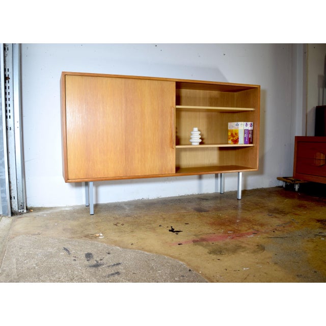This is an elegant WK Möbel sideboard from the 1960s. The cabinet features a simple, minimalist design, characteristic of...