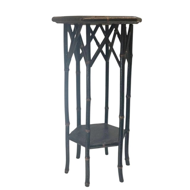 A charming and sculptural English bamboo plant stand dating to around 1900, crafted in the art nouveau style. The stand...