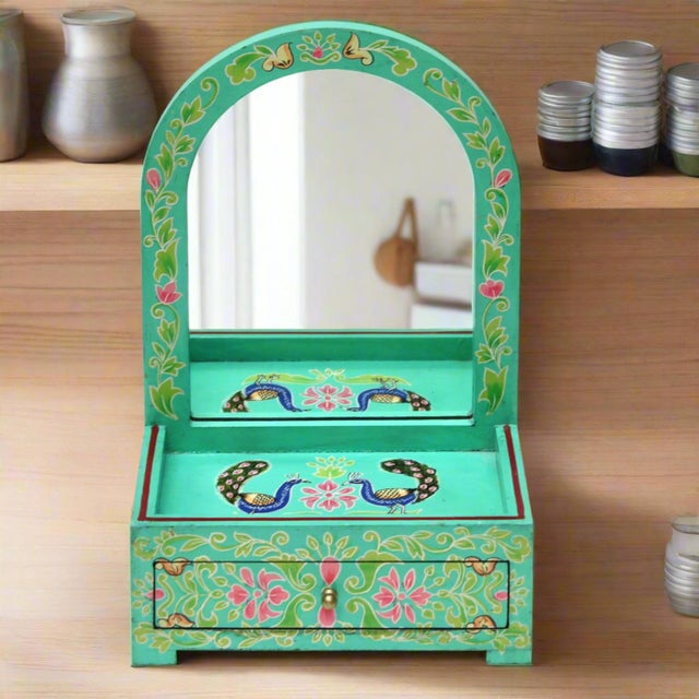 This handcrafted wooden jewelry box features a pull-out drawer and small mirror.hand-painted peacock and floral design on...