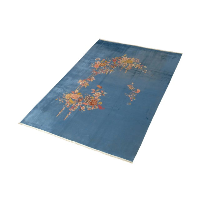 Handcrafted with care using high-quality wool, this rug features elegant blue tones and intricate floral patterns that...