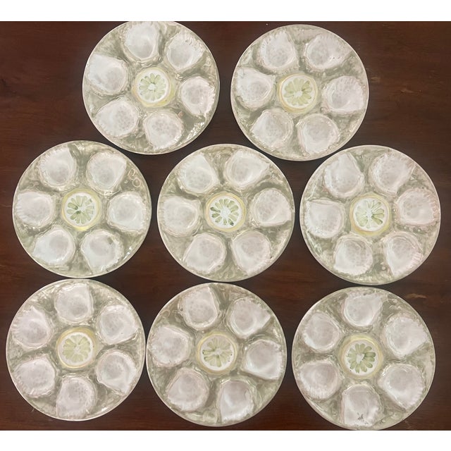 Hand painted oyster plate made in the 21st century in Europe. The plate has six wells with one well in the center for...
