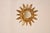 Mid-20th century gilt wood sunburst mirror from France. The central mirror is surrounded by a hand carved edge and outer...