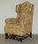 Lovely pair of antique Italian / Carolean throne armchairs with ornately carved bases and floral upholstery which are...