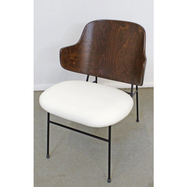 Offered is a restored original 'Penguin' chair, designed by IB Kofod Larsen for Selig. This piece was designed in 1953 and...