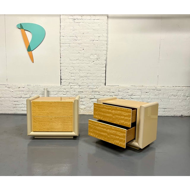Long discontinued pair of modern Italian lacquered nightstands trimmed in leather with satinwood tops and drawer fronts....