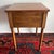 Antique Sheraton Style wood table with one drawer and turned legs.