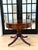 Elegant vintage Regency-style drum table featuring a rich mahogany finish, a classic round top, and a single drawer for...