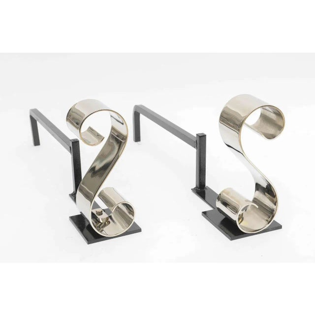 Scroll design andirons, nickel-plated with black iron.