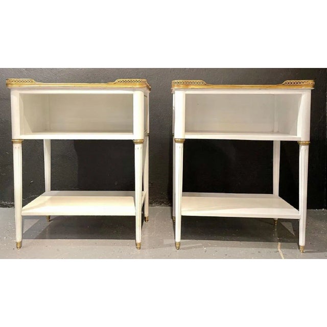 Pair of Swedish neoclassical open nightstands or end tables in the manner of Maison Jansen. These finely crafted open end...