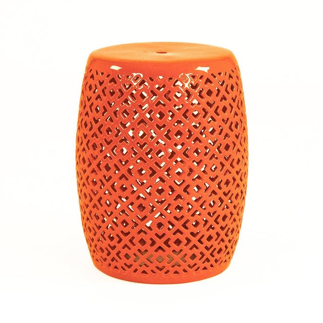 The Lorin Garden Stool is a ceramic garden stool with a barrel form and a geometric diamond pierced pattern in a high-...
