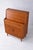 This mid century teak desk by Jentique combines classic British modernist furniture design with practical function, ideal...