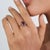 This Retro-style ring featuring a 1.77 carat Rubelite and blue sapphire, set in 18K yellow gold. The pear shape center...