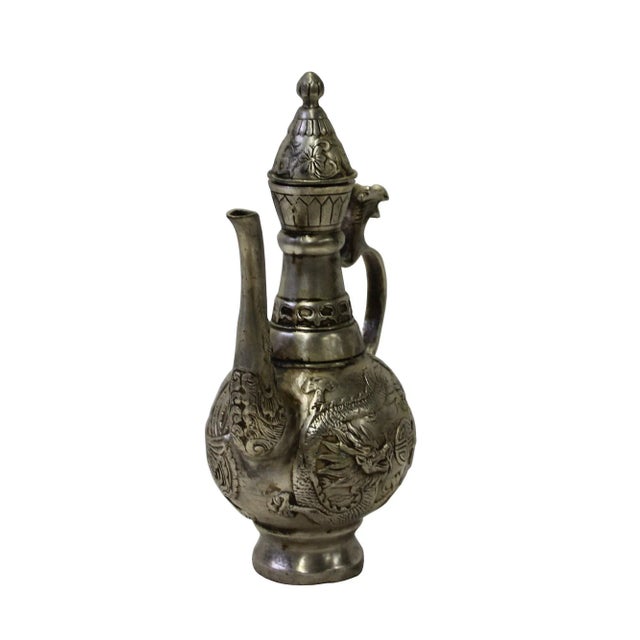 This is a handmade metal silver color finish jar shape display with phoenix dragon motif accent design. For display...