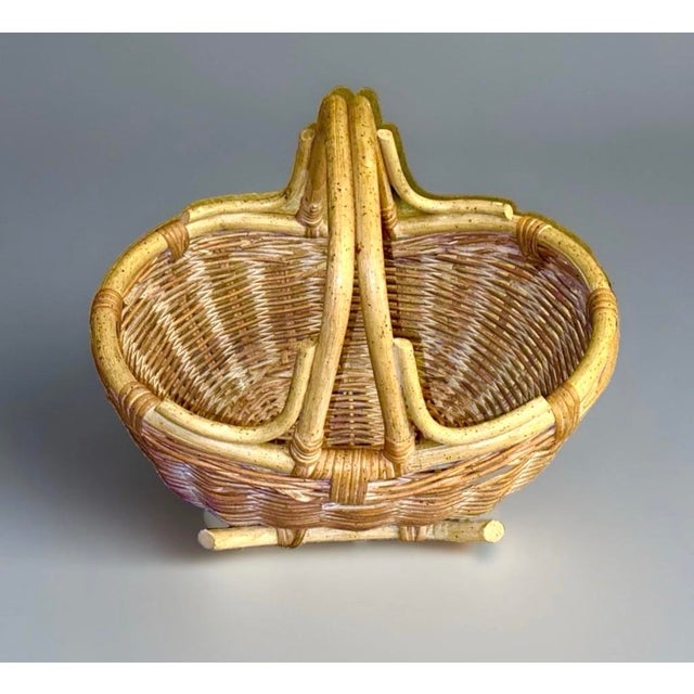 Beautiful hand‑woven rattan basket featuring a sturdy double‑handle frame and a soft white‑wash patina that highlights its...