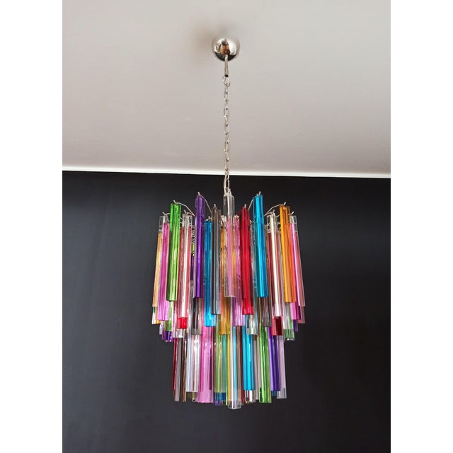 Fantastic vintage murano chandelier made by 107 murano crystal multicolored prism in a nickel metal frame. The glasses are...