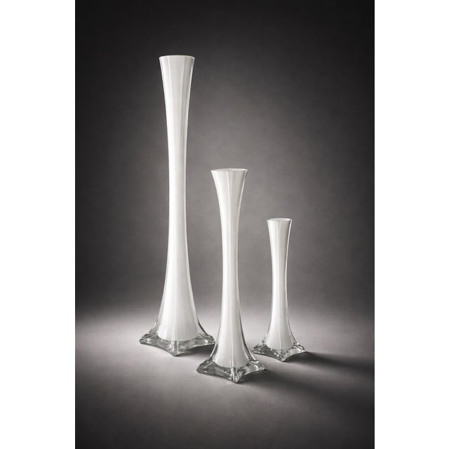 A striking set of three graduated sculptural trumpet vases crafted in luminous cased opaline art glass. Rising to 27.5...