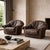 A pair of exceptionally comfortable late 20th-century lounge chairs featuring a relaxed, "slouchy" silhouette. Upholstered...