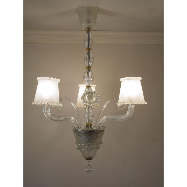 Vintage Murano blown glass chandelier by Barovier & Toso, featuring three lights. The three frosted glass lampshades,...