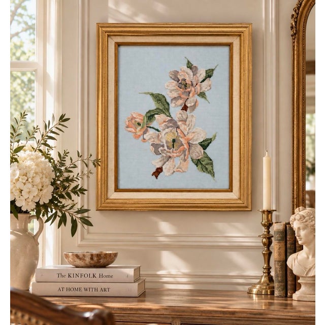 Charming vintage floral needlepoint featuring a delicate arrangement of soft blush, cream, peach, and green flowers worked...