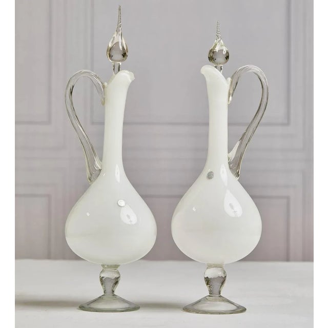 From my personal collection, a striking pair mid-20th century Italian Murano cased glass white decanters. Hand-blown with...