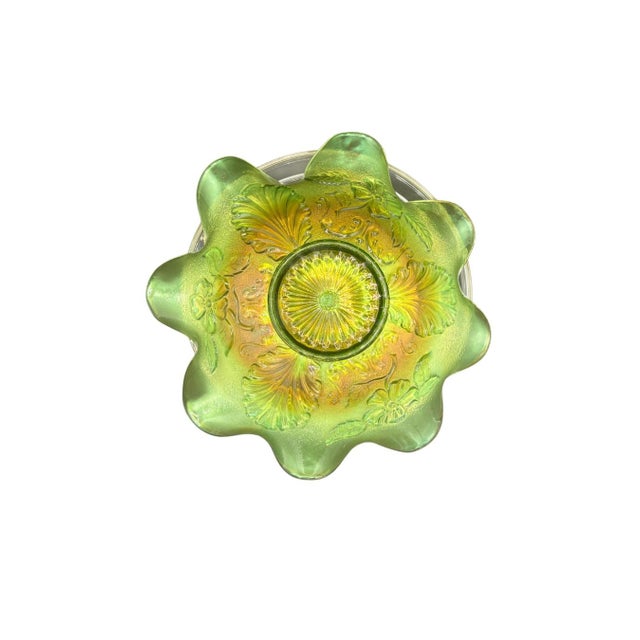 A beautiful antique Northwood “Blossoms & Palms” carnival glass bowl, produced in the early 20th century, circa 1908–1915....