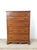 This mid century colonial revival highboy dresser features hardwood construction, original maple finish, five dovetailed...