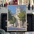 The artwork captures a sunlit morning scene at 12 Downing, showcasing the elegant architecture of the building framed by...