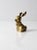 A vintage brass rabbit figurine with a clean, sculptural form and gently modern lines. The solid weight gives it a...
