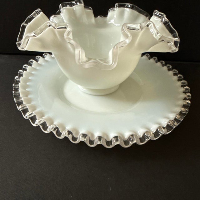 This ruffled milk glass bowl or bonbon dish, with matching plate was commonly produced by Fenton in the Silver Crest line...