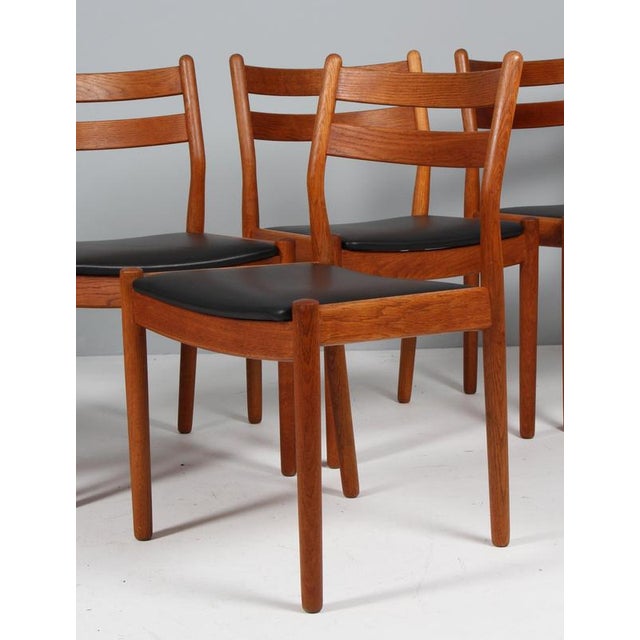 Set of five dining chairs by Poul Volther with frame of oak. New upholstered cushions with black full grain aniline...