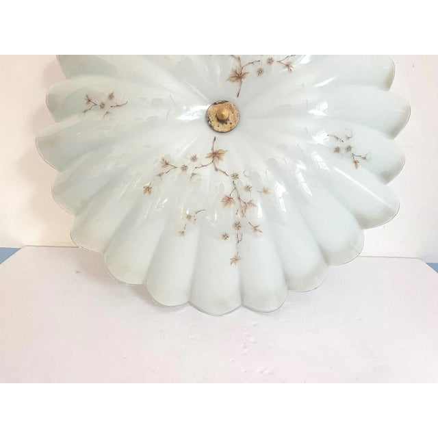 Fabulous 1950s fluted and frosted glass ceiling light in the shape of a large open parasol accented by hand painted soft...