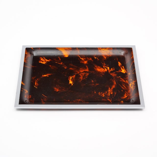 Tray from mid-century France. This piece is made of Lucite in a brown tortoiseshell pattern. It is trimmed with chromed...