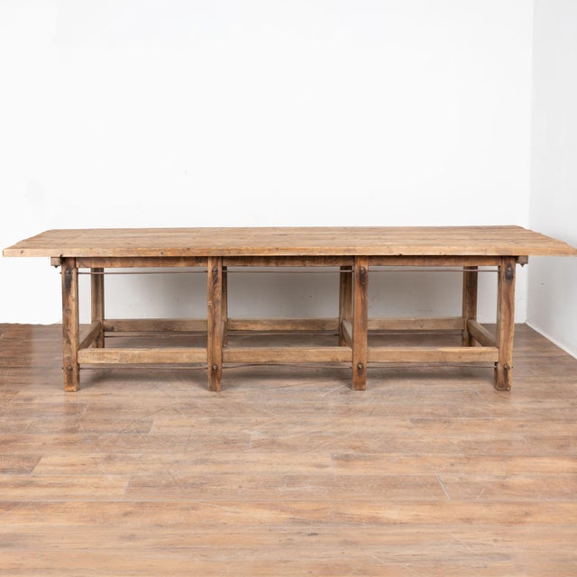 This rustic work table is just under 10' long, reinforces with iron rods and bolts, and resting on eight legs. This long...