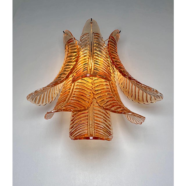 Fantastic pair of vintage Murano wall sconce made by 6 Murano Amber Felci glasses for each applique in a chrome metal...