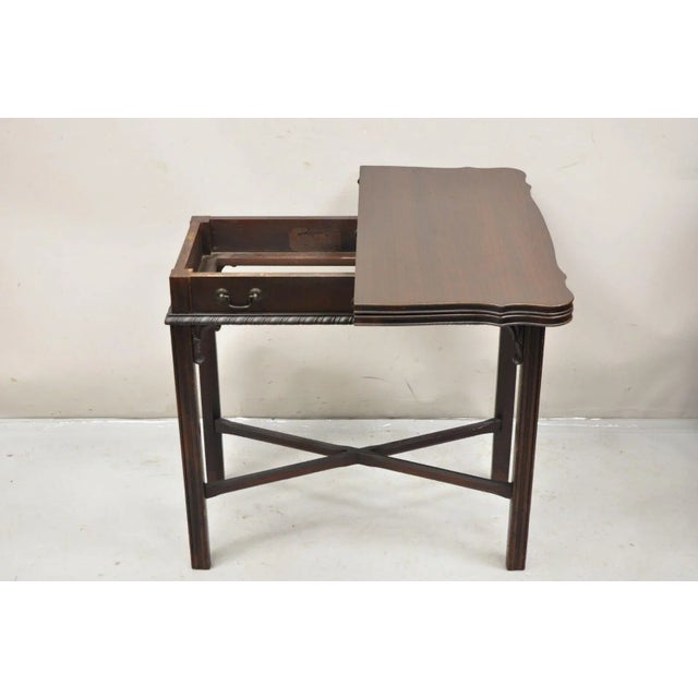 Antique Mahogany Georgian Style Flip Top Console Game Table. Item features a Faux drawer, spin and flip top, rope carved...