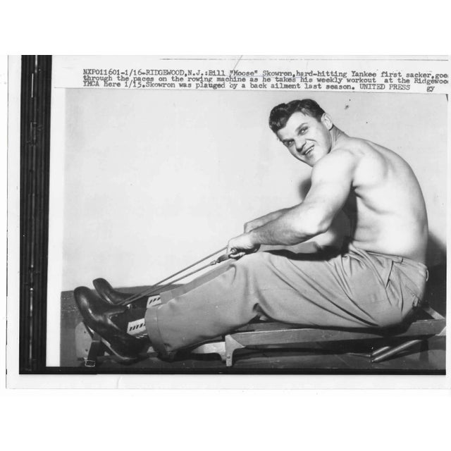 1958 black and white photo of NY Yankee first baseman Bill "Moose" Skowron shirtless working out on a rowing machine.