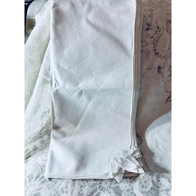 A Vintage handmade set of 12 white lace corners napkins 16”× 16" each. They are constructed with a classic crisp cotton...
