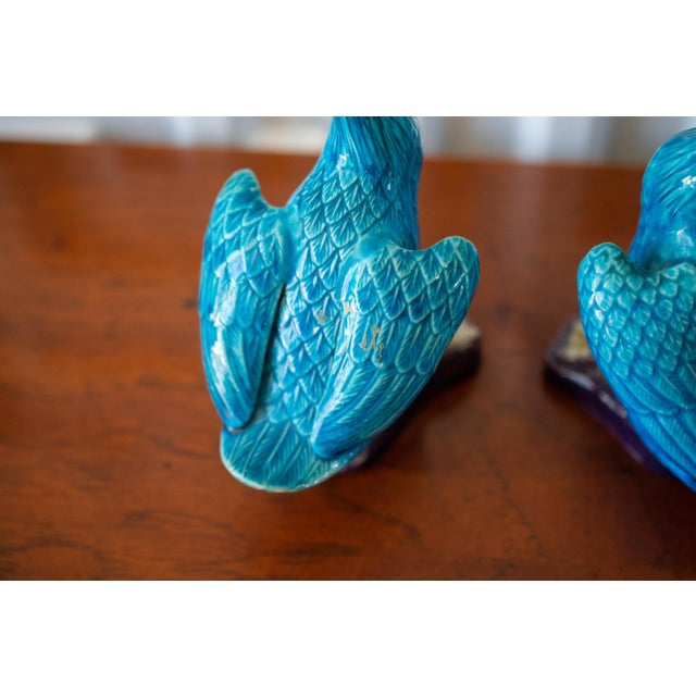 This listing is for a pair of Chinese ceramic ducks glazed in cerulean blue on platform purple glazed base(s) with exposed...