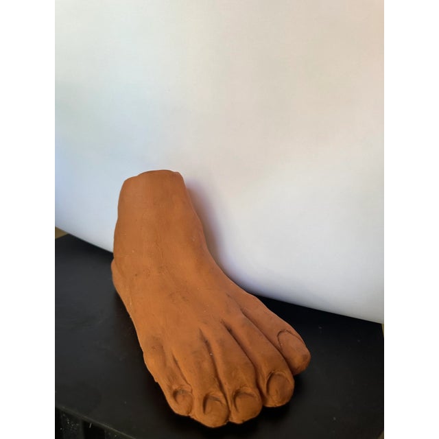 Terracotta foot sculpture. Signed by artist Sue Fail.