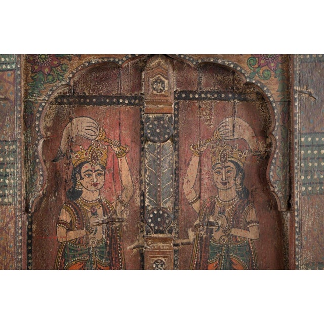 Antique Indian Painted Teakwood Window Panel, the frame showing a center shaped arch, with the 2 window panels behind...