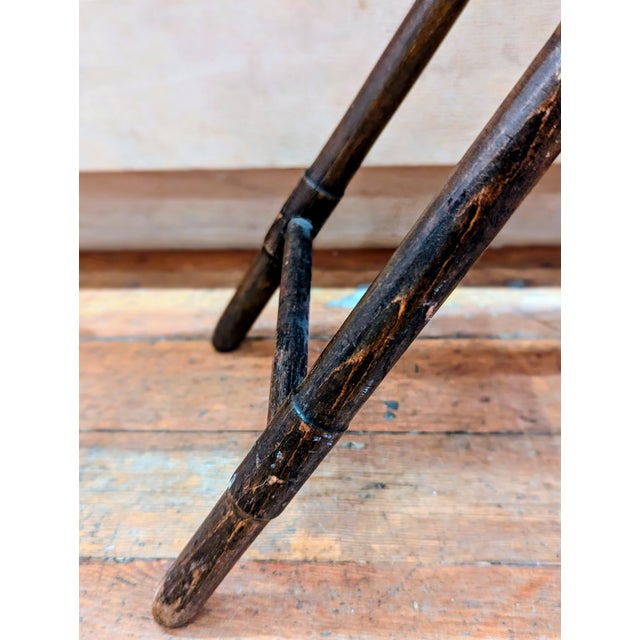 English folding campaign stool, Edwardian period, late 19th–early 20th century. Turned hardwood tripod frame with canvas...