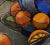 Fruit still life with blue pitcher and ripe oranges on a table in the cubist style. Composition of repetitive circular...